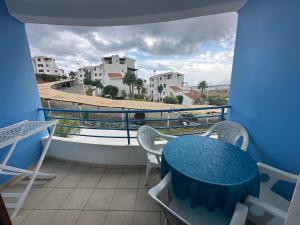 a balcony with a table and chairs and a view at Appart-Hotel cabo dream in Cabo Negro