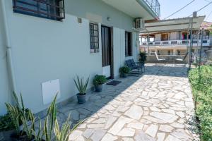 a patio outside of a house with plants at Filoxenia House at Anemochori village in Pyrgos