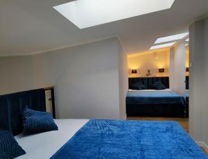 Posteľ alebo postele v izbe v ubytovaní Hugo VIP Apartments