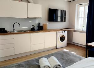 Kuchyňa alebo kuchynka v ubytovaní Hugo VIP Apartments