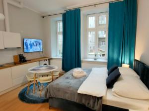Posteľ alebo postele v izbe v ubytovaní Hugo VIP Apartments