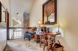 a home office with a desk and a chair at Pines 75 Townhome in Breckenridge