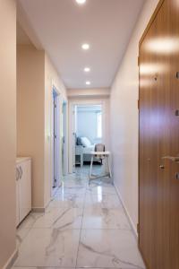 a hallway with a door and a table in a room at One and Only Brandnew Full Apartment in Istanbul