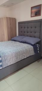Ein Bett oder Betten in einem Zimmer der Unterkunft Hotel INTI