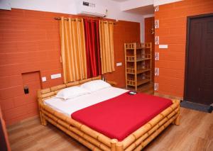 Кровать или кровати в номере Viruksham Homestay