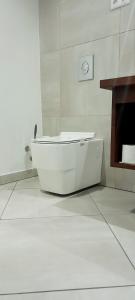 a white bath tub sitting in a bathroom at La Varangue in Antananarivo