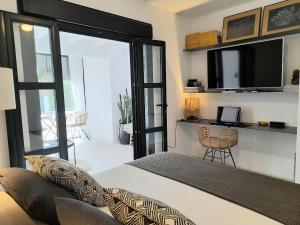 a bedroom with a bed and a sliding glass door at casita en la playa in El Rompido