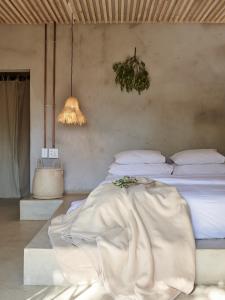 a bedroom with a bed with a blanket on it at FARMHOUSE58 in Krugersdorp