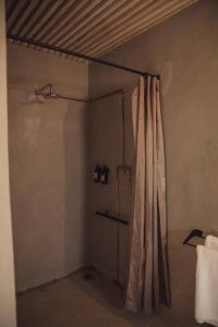 a shower in a bathroom with a shower curtain at FARMHOUSE58 in Krugersdorp