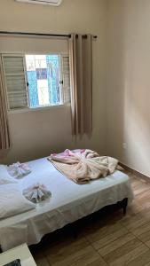 Un ou plusieurs lits dans un hébergement de l'établissement Hotel Cidade Aventura