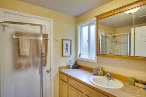 a bathroom with a sink and a mirror at Swim, Hike and Fish Owls Nest Gold Bar Cabin in Gold Bar +37 photos