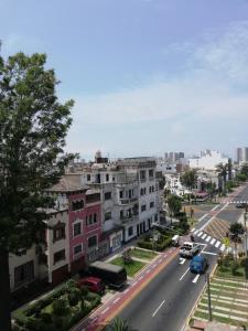 an aerial view of a city street with buildings at Hotel Residencial Alfa in Lima