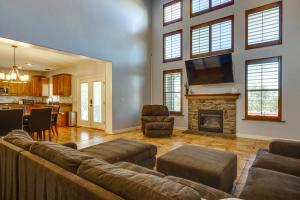 a living room with a couch and a fireplace at Game Room and Home Office Spacious Kaysville Escape in Kaysville