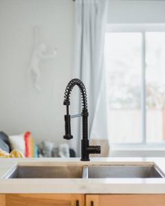 a kitchen sink with a black faucet at Casa Nova - Central San Diego FREE parking in San Diego