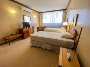 Nobile Suites Excelsior Asuncionにあるベッド
