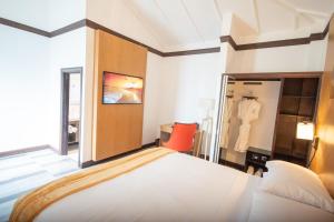 Letto o letti in una camera di Sago Palm Hotel