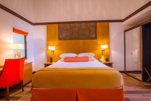 Letto o letti in una camera di Sago Palm Hotel