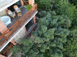 an overhead view of a house with a deck and trees at Villa Vejini in Mamkoda