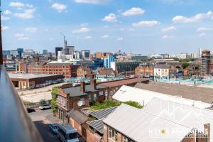 an aerial view of a city with buildings at City Living Made Easy: 2BR Apartment in Birmingham in Birmingham