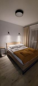 Posteľ alebo postele v izbe v ubytovaní Leszka Loft Apartment