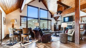 a living room with a table and chairs at Breckenberg Haus in Breckenridge