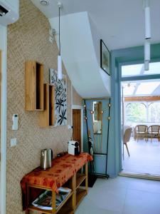 a kitchen with a table and a dining room at La Waide in Amiens