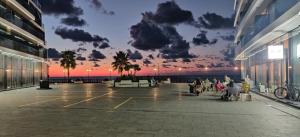 a rendering of a building with a sunset in the background at Batumi Sea View in Batumi