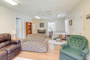 a living room with a couch and a chair at Tennessee Farm Vacation Rental with Game Room! 