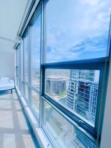 a large window with a view of a city at Oceanview 25th Floor Luxury Penthouse in Santa Ana