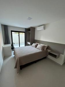 Postel nebo postele na pokoji v ubytování A Jóia de Costa Azul, a 50 Mt da praia