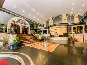 a lobby of a building with stairs and a building at Nobile Suites Excelsior Asuncion in Asuncion