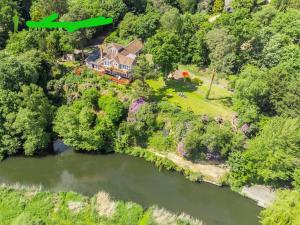 an aerial view of a house next to a river at Guest have the sole use limited in Saint Ives