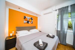 a bedroom with a large bed and a window at Apartman Marta in Zavalatica