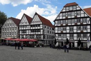 a group of buildings with people walking in front of them at Soester Altstadt Apartment in Soest