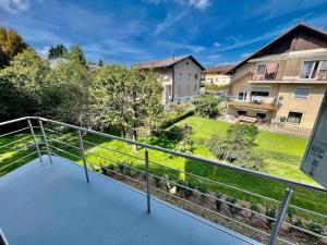 a balcony with a view of a yard at 4 Bedroom House On The Hill in Ljubljana