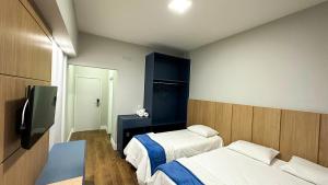 Postel nebo postele na pokoji v ubytování Hotel Colibri Viçosa - Próximo a UFV