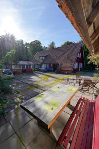 a picnic table sitting on top of a patio at Skruzdėlynas in Nida