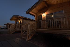 a log cabin with two decks at night at Pet Friendly Cabins in Hanksville Utah in Hanksville
