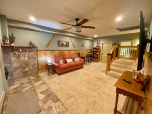 a living room with a couch and a ceiling fan at New Listing! Mountainview Escape in Dahlonega