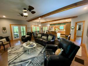 a living room with leather furniture and a table at New Listing! Mountainview Escape in Dahlonega