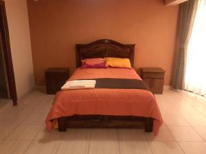 Säng eller sängar i ett rum på Hotel Casa Grande F&J