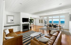 a living room with a couch and a table at Malibu Paradise with Pool, Hot Tub, and Ocean Views in Malibu