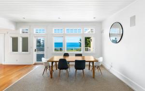 a dining room with a table and chairs at Malibu Paradise with Pool, Hot Tub, and Ocean Views in Malibu
