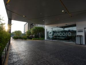 a building with a sign on the side of it at Ramada Encore by Wyndham Queretaro in Querétaro