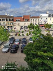 a group of cars parked in a parking lot at Charmant studio à Montmorency in Montmorency