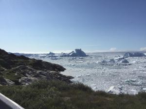 a view of the icebergs in the ocean at B&B Ire in Ilulissat