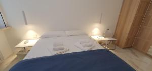 A bed or beds in a room at Appartamenti Reali Bonaccini