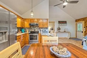 a kitchen with wooden cabinets and a wooden table at The Falls in Hood