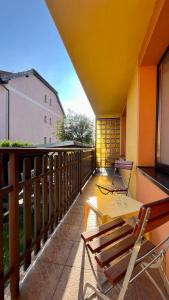 a patio with a table and chairs on a balcony at Apartmán Cimca in Cheb +3 photos