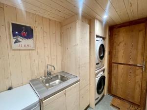 a kitchen with a sink and a washing machine at Chalet Crest-Voland, 2 pièces, 4 personnes - FR-1-505-186 in Crest-Voland